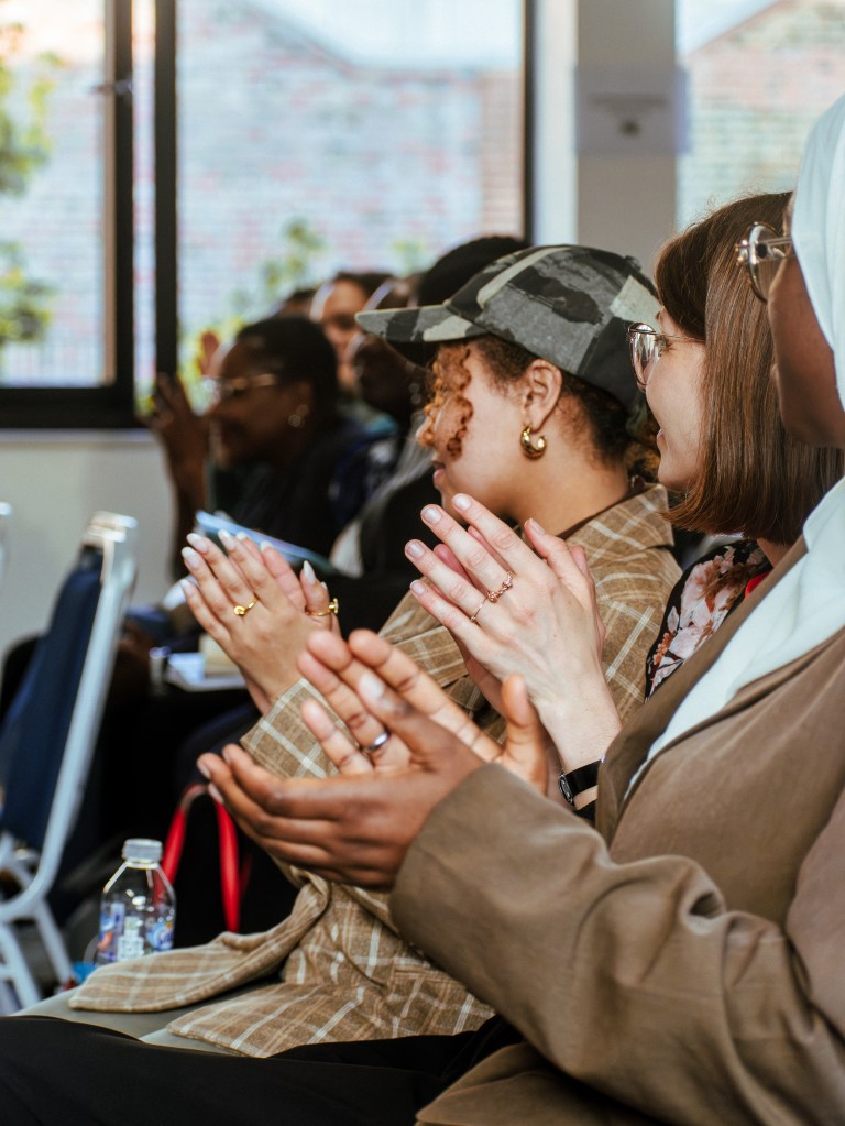 A photo of the audience mid-applause at one of Bounce Black's events at the Africa Centre in London.
